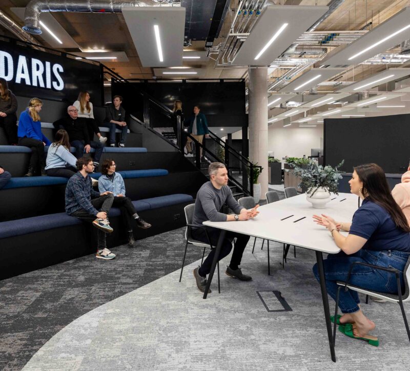 Amdaris team members working in the company's office space