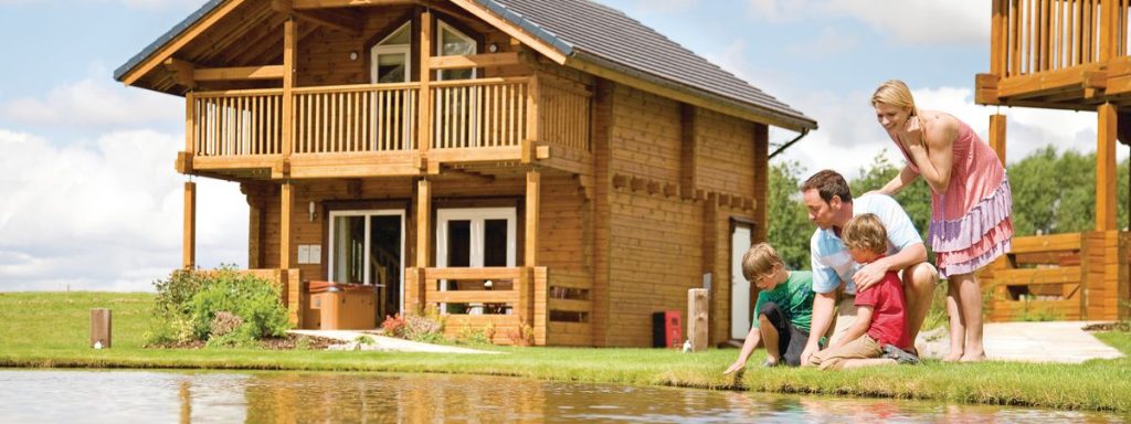 A family at a lodge in a Coppergreen Leisure Resort