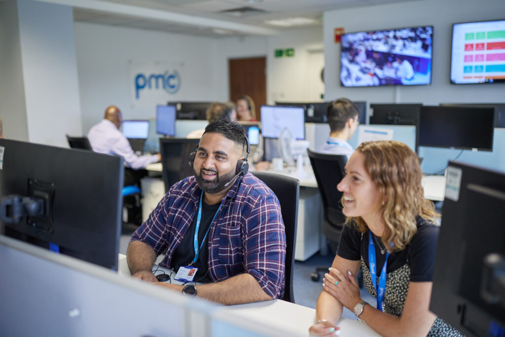 PMC team members working in one of their offices