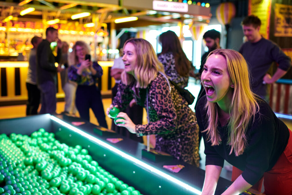 Guests playing games at Fairgame Canary Wharf