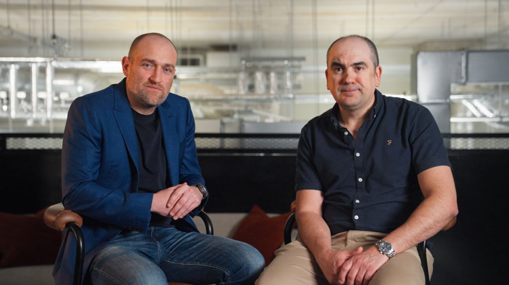 Andy Rogers and Vlad Nanu, Co-Founder of Amdaris, on the set of their Stories of Growth interview